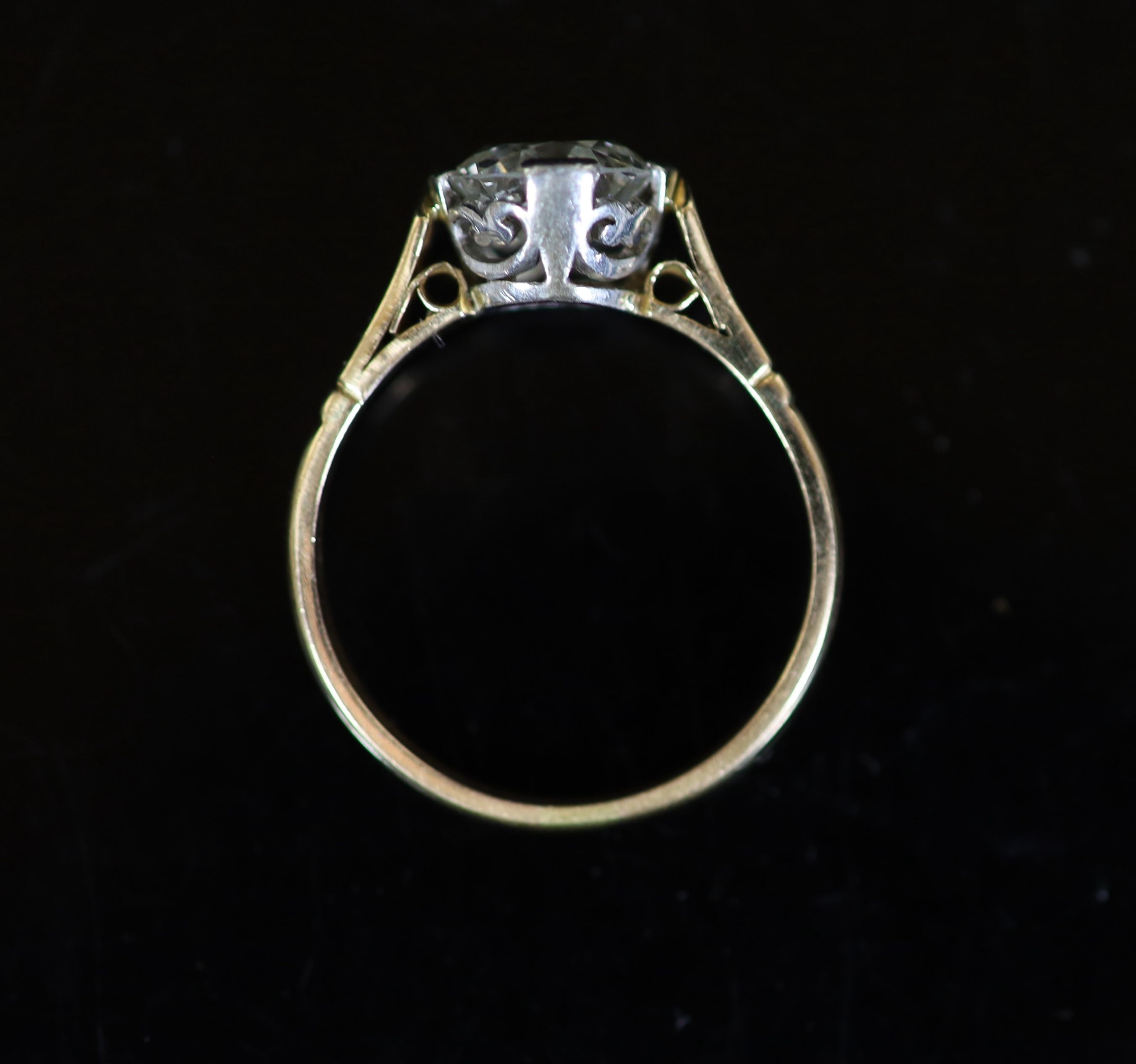 A gold and solitaire diamond ring